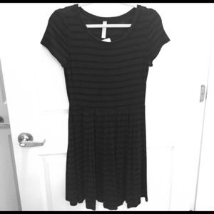 Just below the knee, t-shirt dress.