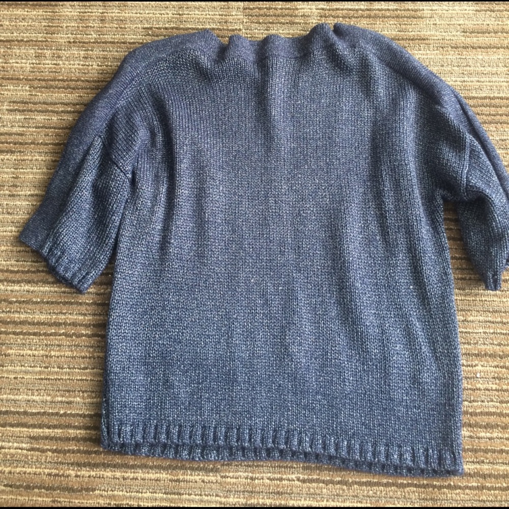 A blue sweater with tints of silver in it.