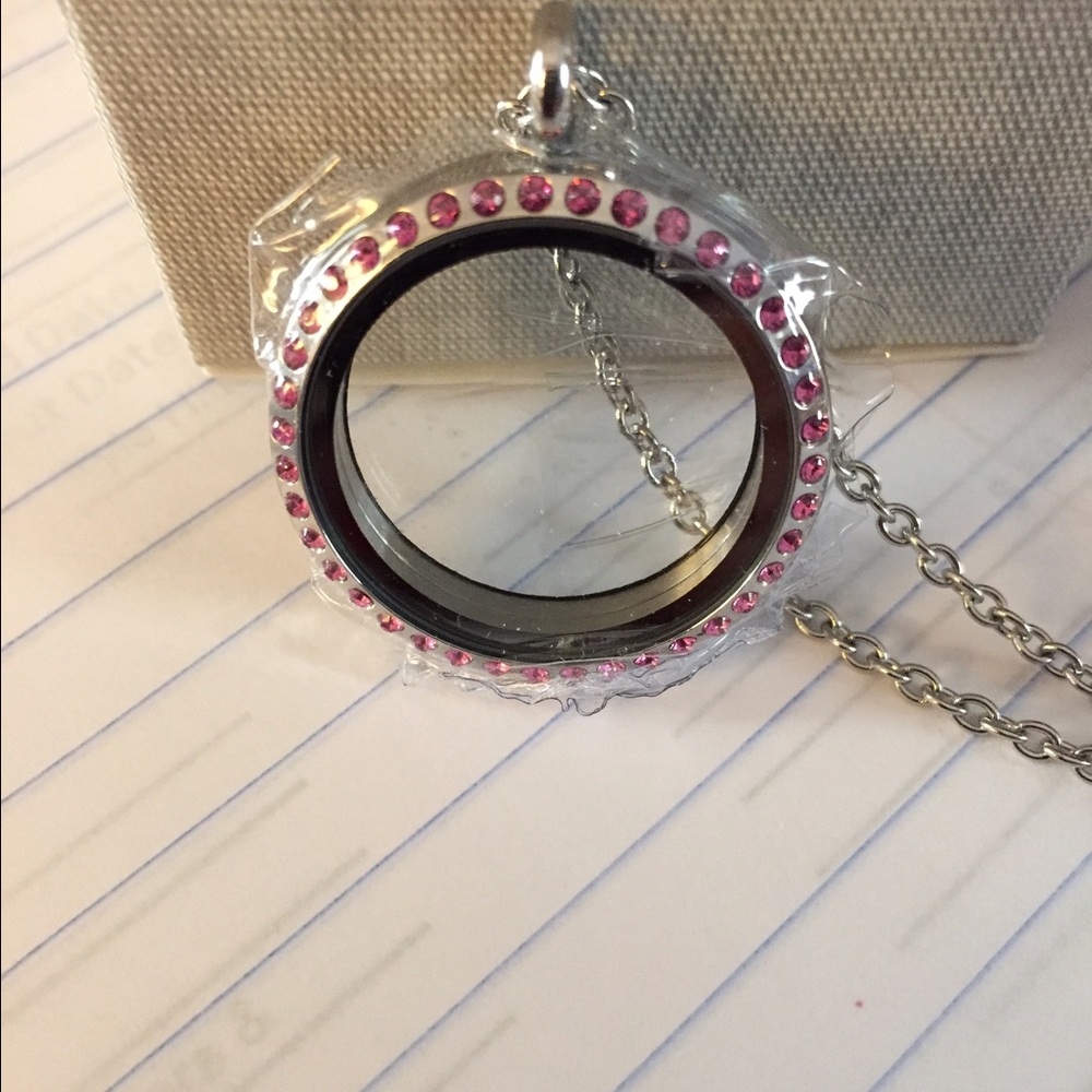 Large silver locket with pink stones