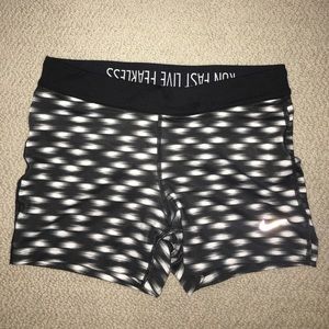 Black and white Nike running shorts