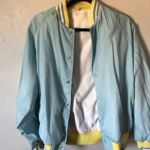 blue and yellow bomber jacket