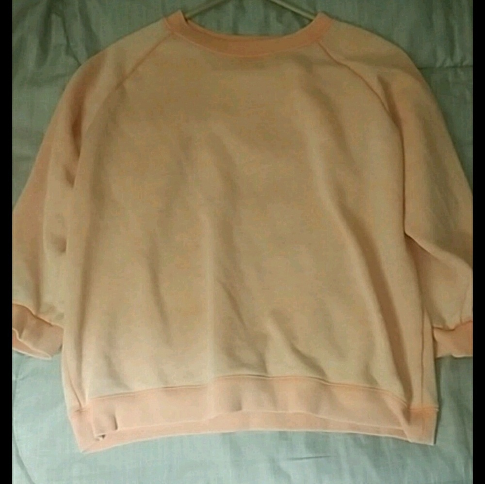Faded orange sweater