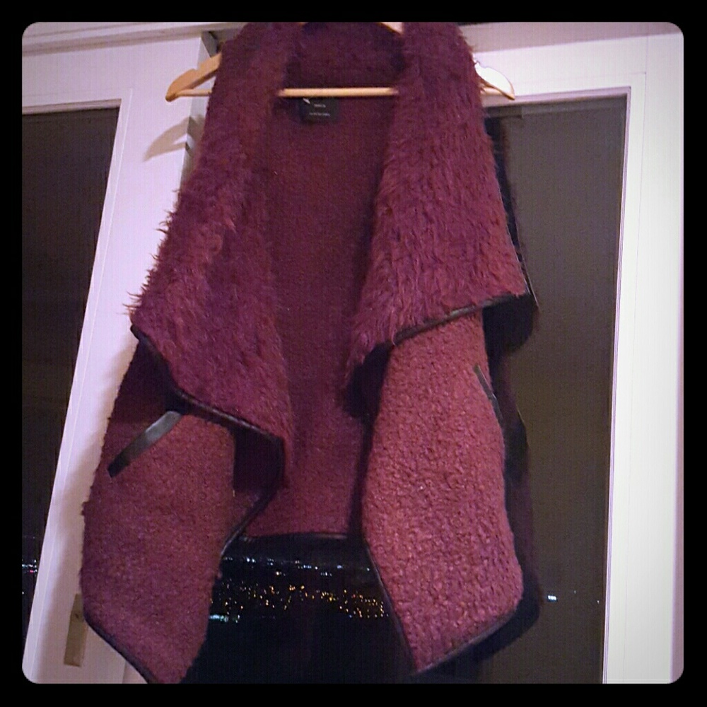 Fur vest with leather trim