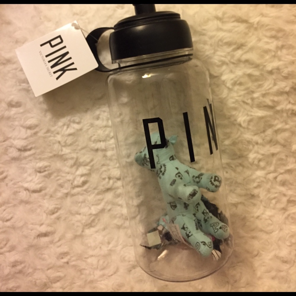 Pink water bottle with plush dog