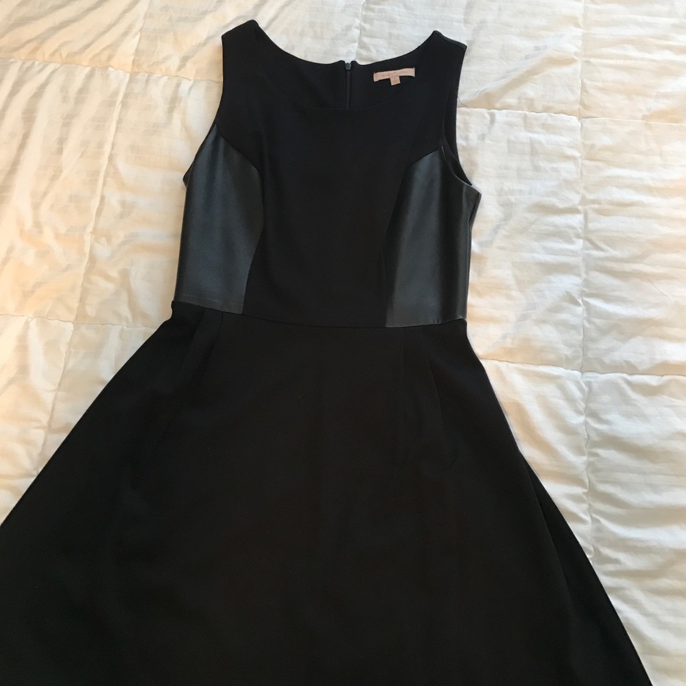 Black cocktail dress with leather cut outs