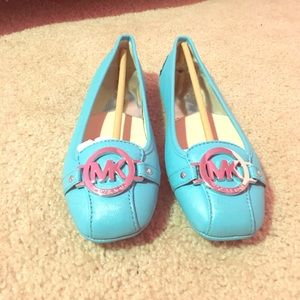 Blue Michael Kors flats.