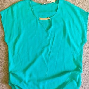 Loose, formal top with gold details.