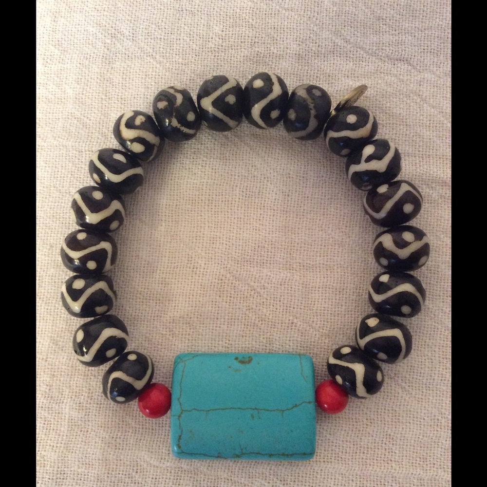 Turquoise bead, red beads, black/white wood beads