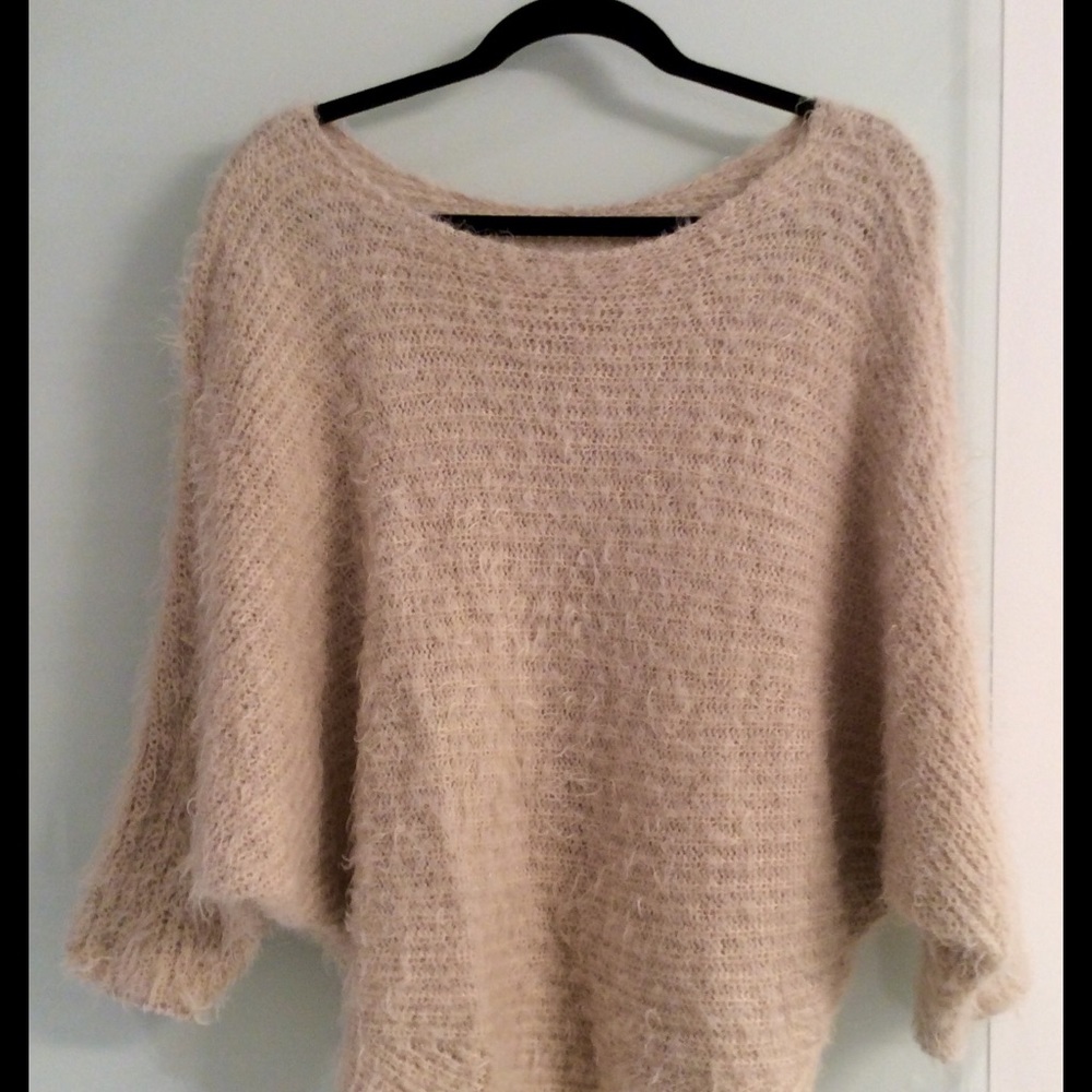 Beige furry sweater.