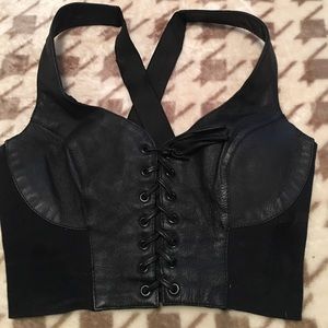 Adorable black leather bustiers.