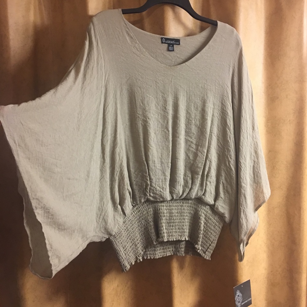 Shirt size Large tan. Flattering