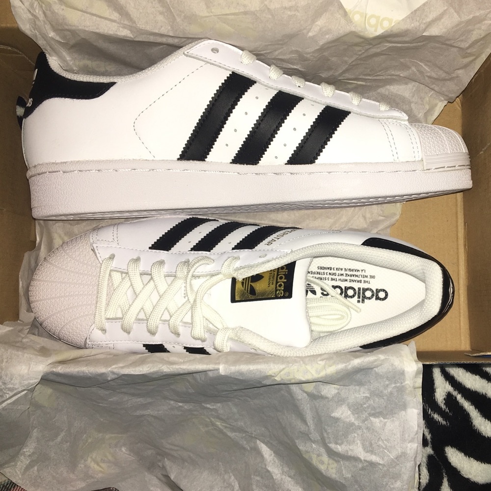 Adidas superstars. White with black stripes.
