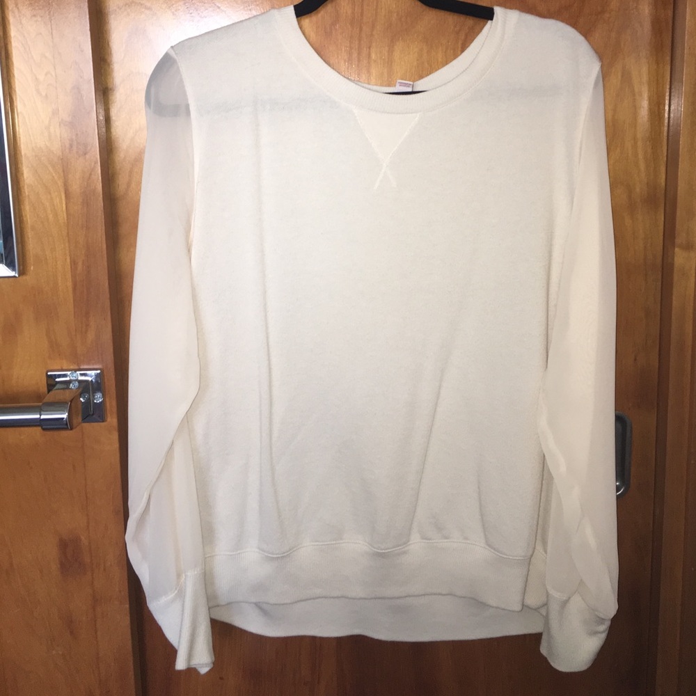 Beige knitted sweater with see-through sleeves