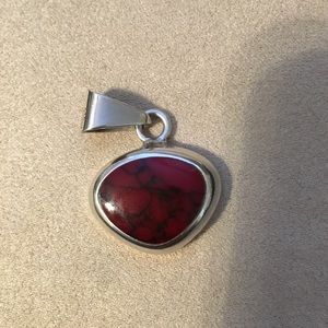 Pretty silver pendant with red stone insert