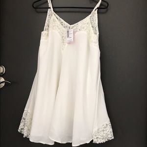 Elegant lace slip on dress in ivory color.