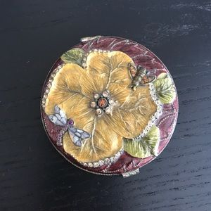 Small decorative hand mirror