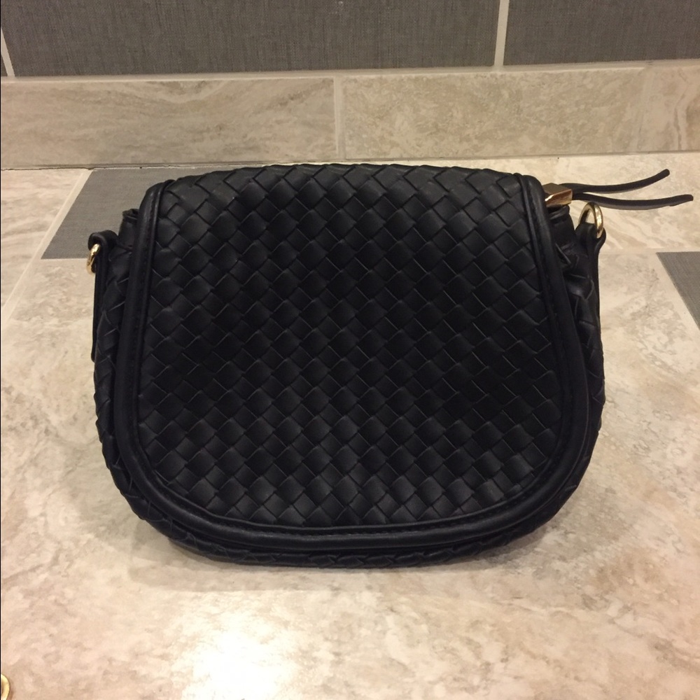 Black quilted faux leather purse.