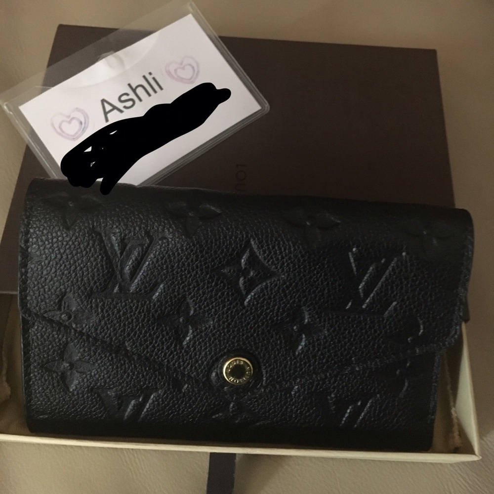 Sold Louis Vuitton Empreinte  Curieuse Wallet