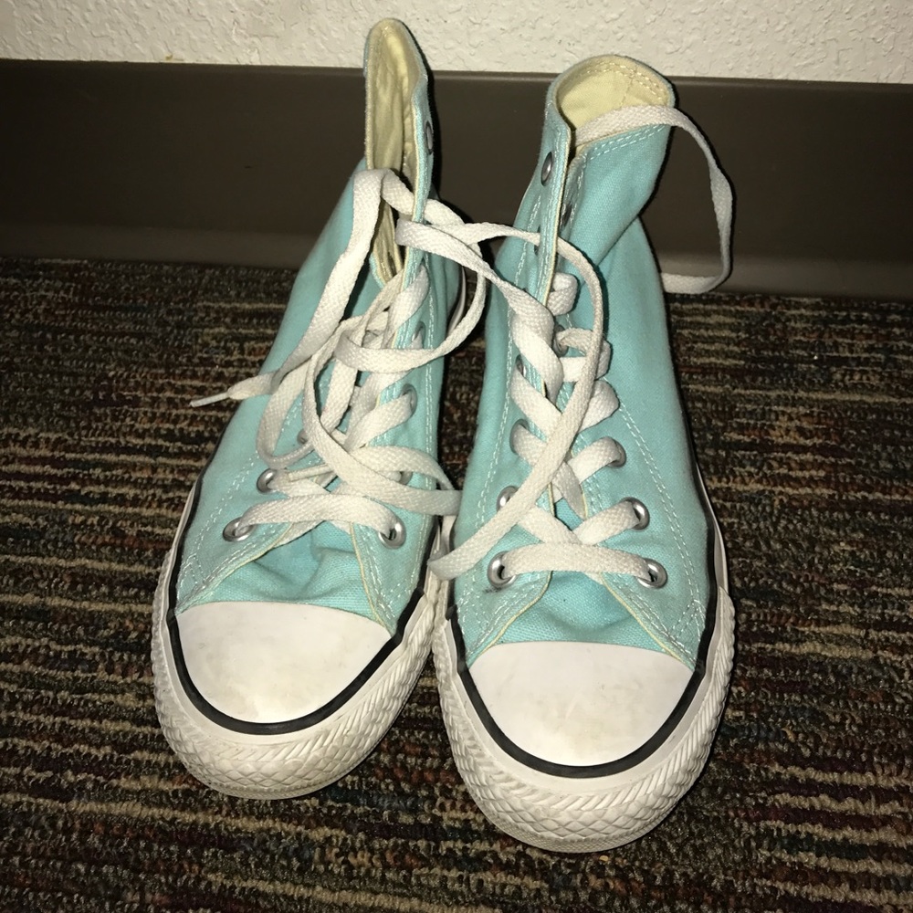 Light blue high top converse
