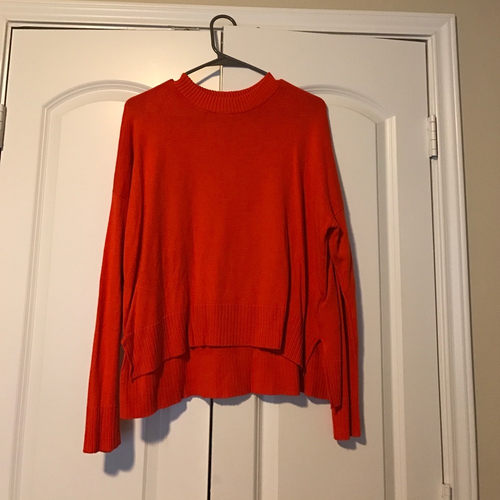 Bright orange sweater