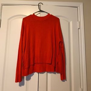 Bright orange sweater