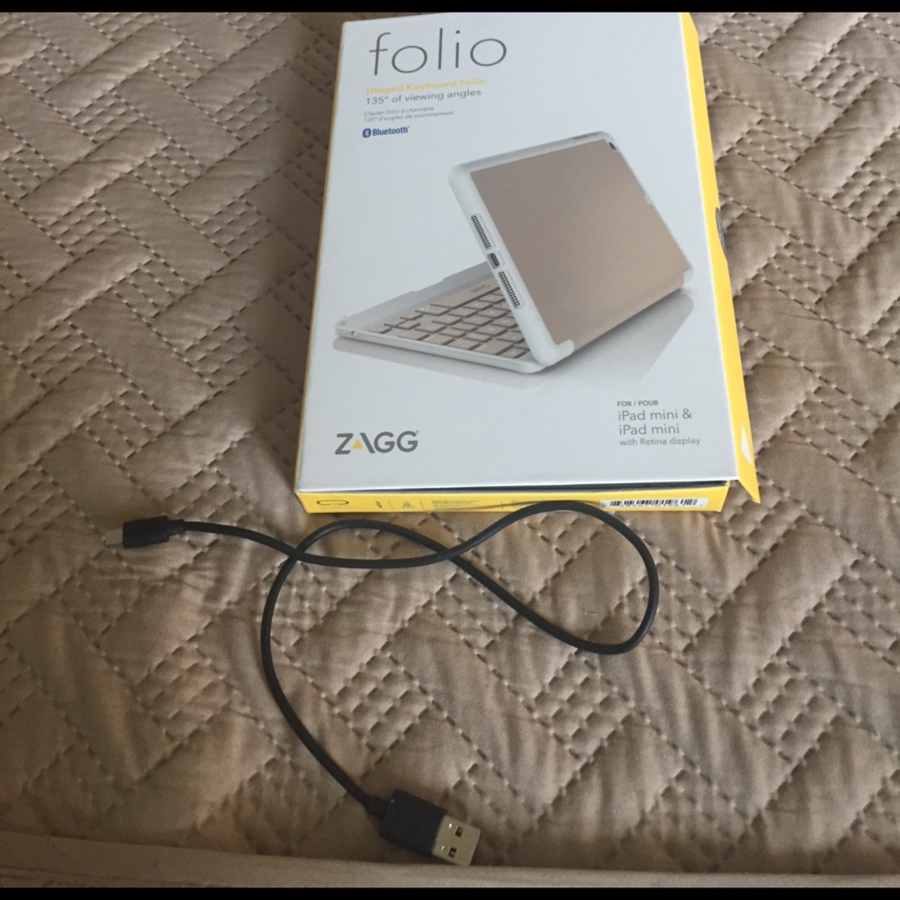 Zagg IPad mini keyboard case. Gold with white trim