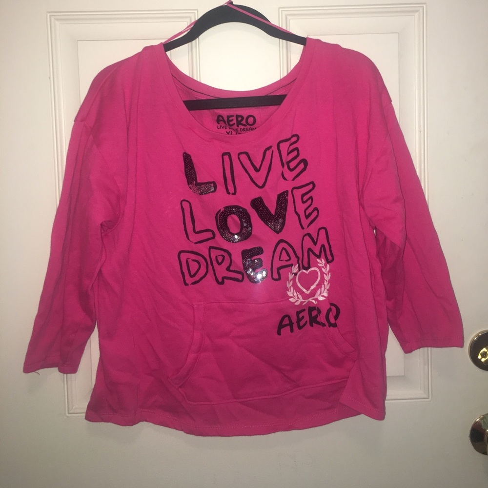 A pink short sweat shirt