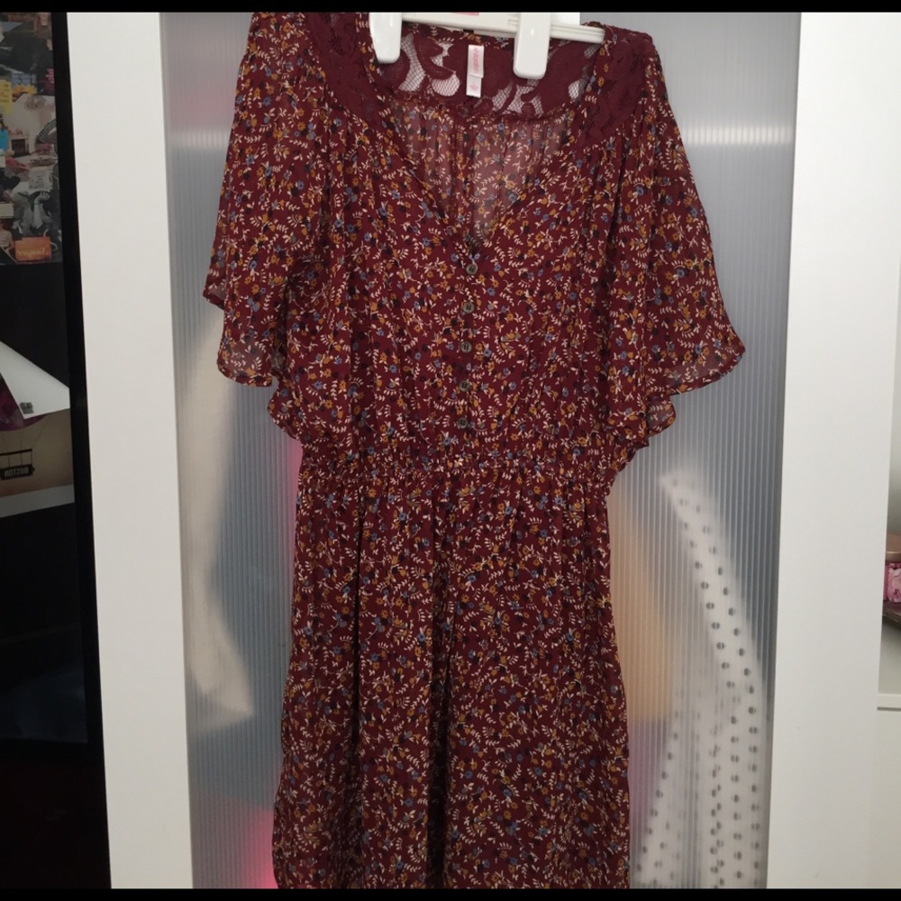 Burgundy floral dress with lace and button details