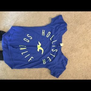 short sleeve blue with green lettering