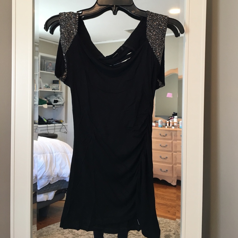 Guess top with slits cut out on the top back area