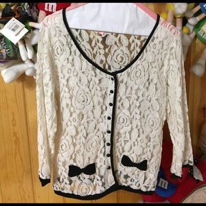 Lace blouse with black trimmings