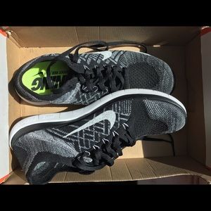 Women's Nike flyknit black wolf grey &white size11