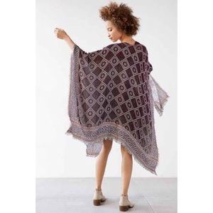 Boho fringe reversible geometric poncho