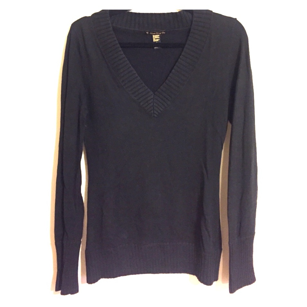 Black v-neck sweater. Low cut sweater.