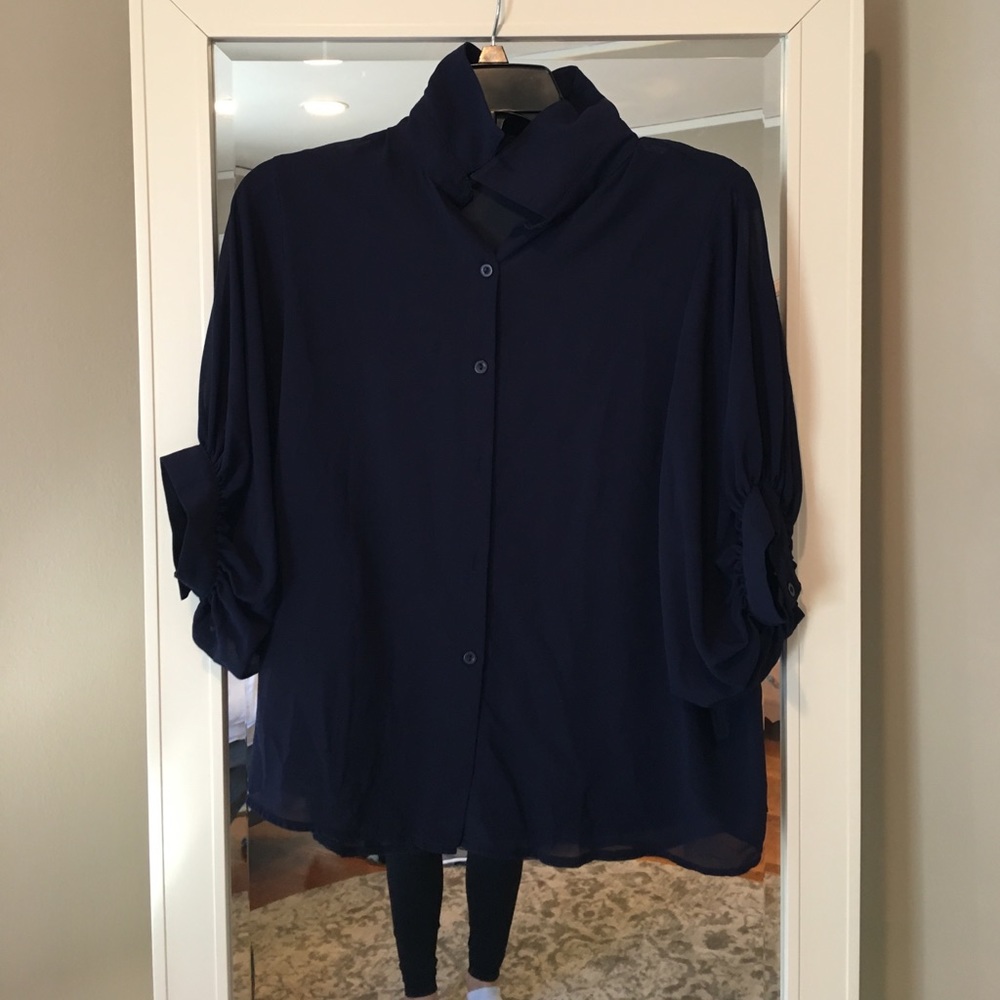 Navy blue button down blouse with buttoned sleeves