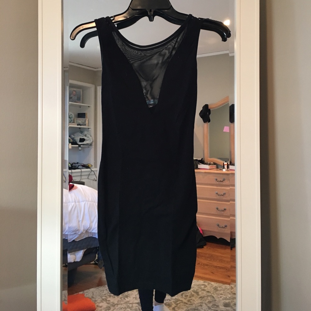Tight black dress with mesh v cut in front