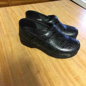 Dansko black tooled clogs