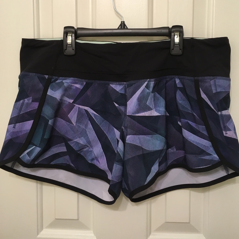 Holding Lululemon Run Times Shorts