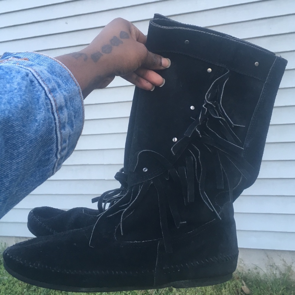 Black moccasins with fringe and studs