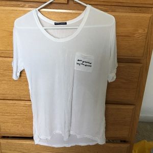 Brandy Melville Tshirt with quote on pocket