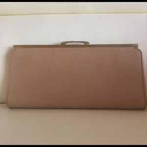 Light tan or dark cream colored leather clutch