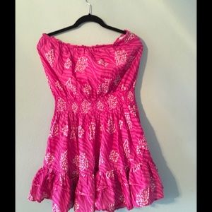 Pink strapless, short type of dress
