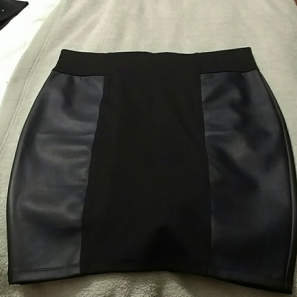 Black polyester with faux leather skirt