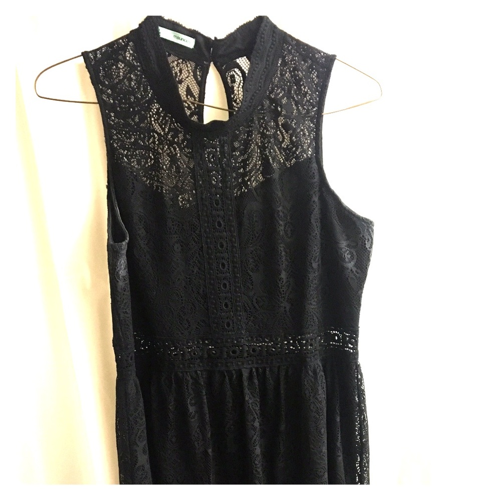 Juniors black dress, high neck, waist cutout.