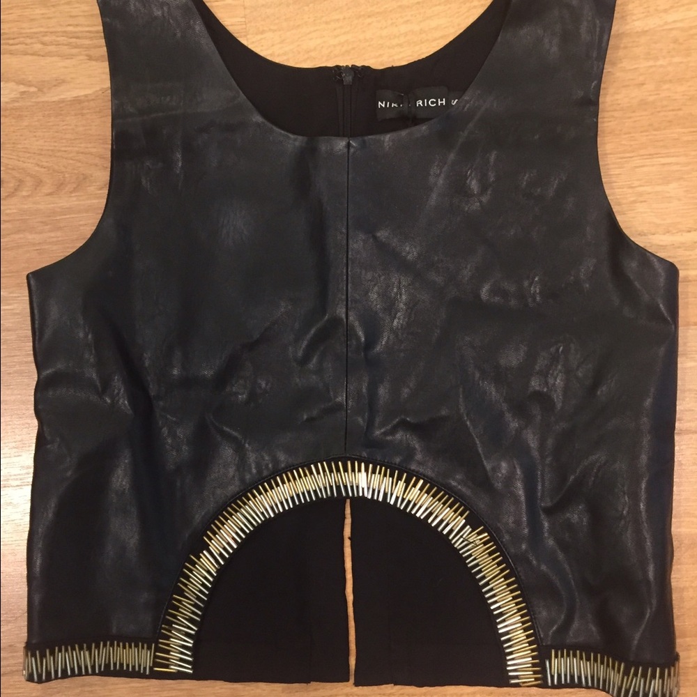 Nikki Rich black leather crop top.
