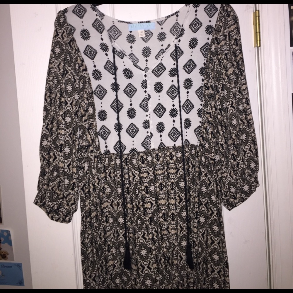 Flow-y patterned dress with string tassels