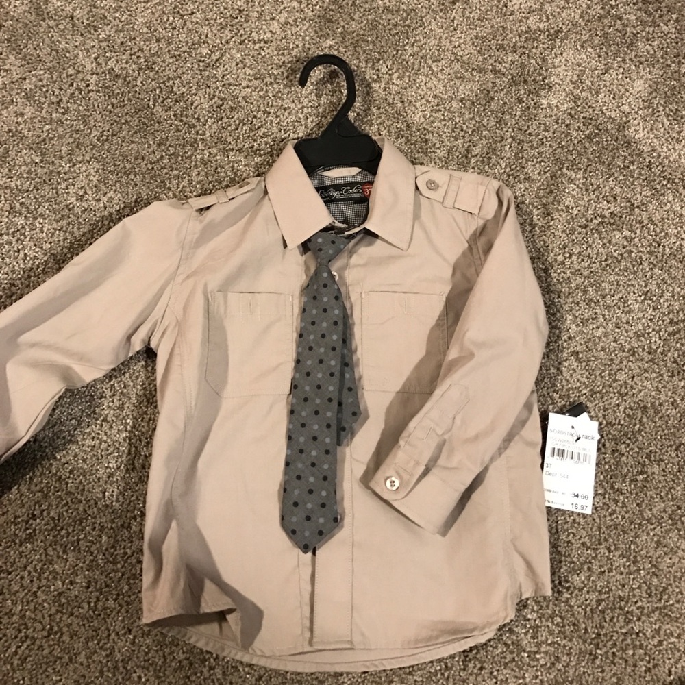Tan collard buttoned down long sleeved shirt.