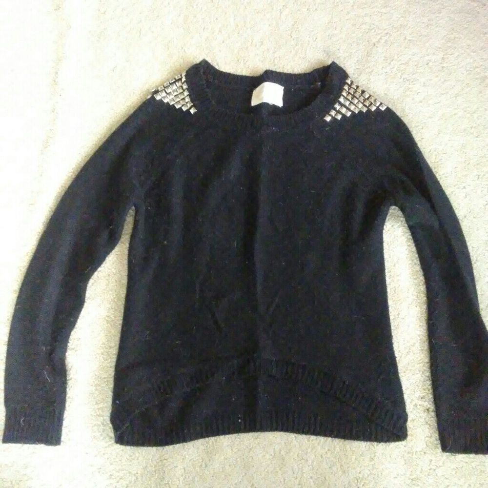 black knit sweater with silver studs