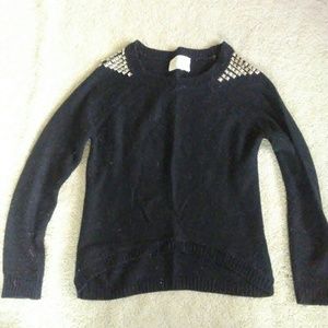black knit sweater with silver studs