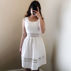 White dress with floral cutouts